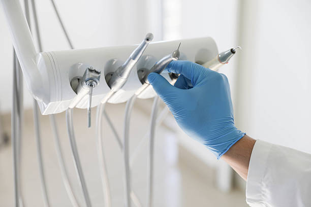Professional Tooth Extraction technician working in Lafayette, IN